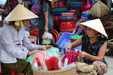 Discover a typical village Thuy Bieu by bike among a grapefruit paradise